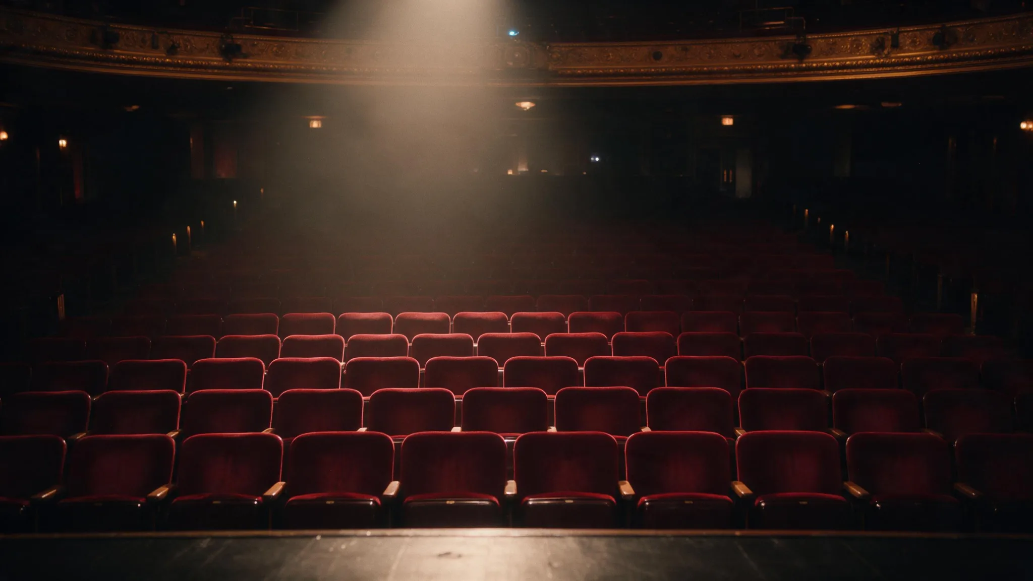 Fictional adult performer entering a moonlit theater illustrating a dolly-in text-to-video direction